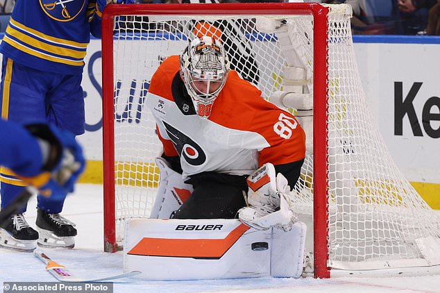 Philadelphia Flyers goaltender Dan Vladar (80) makes a pad save during the first period of an NHL hockey game against the Buffalo Sabres Wednesday, Oct. 21, 2026, in Buffalo, N.Y. (AP Photo/Jeffrey T. Barnes)