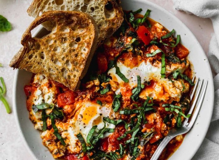 Slide 6 of 14: Whether it's brunch time or dinner time, shakshuka works for it all. This blogger recipe keeps the recipe light and flavorful with saucy tomatoes, eggs, cheese, and lots of herbs.Get the recipe at Walder Wellness.