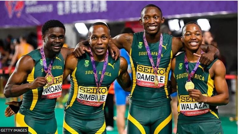 Damphile (second right) with other athletes