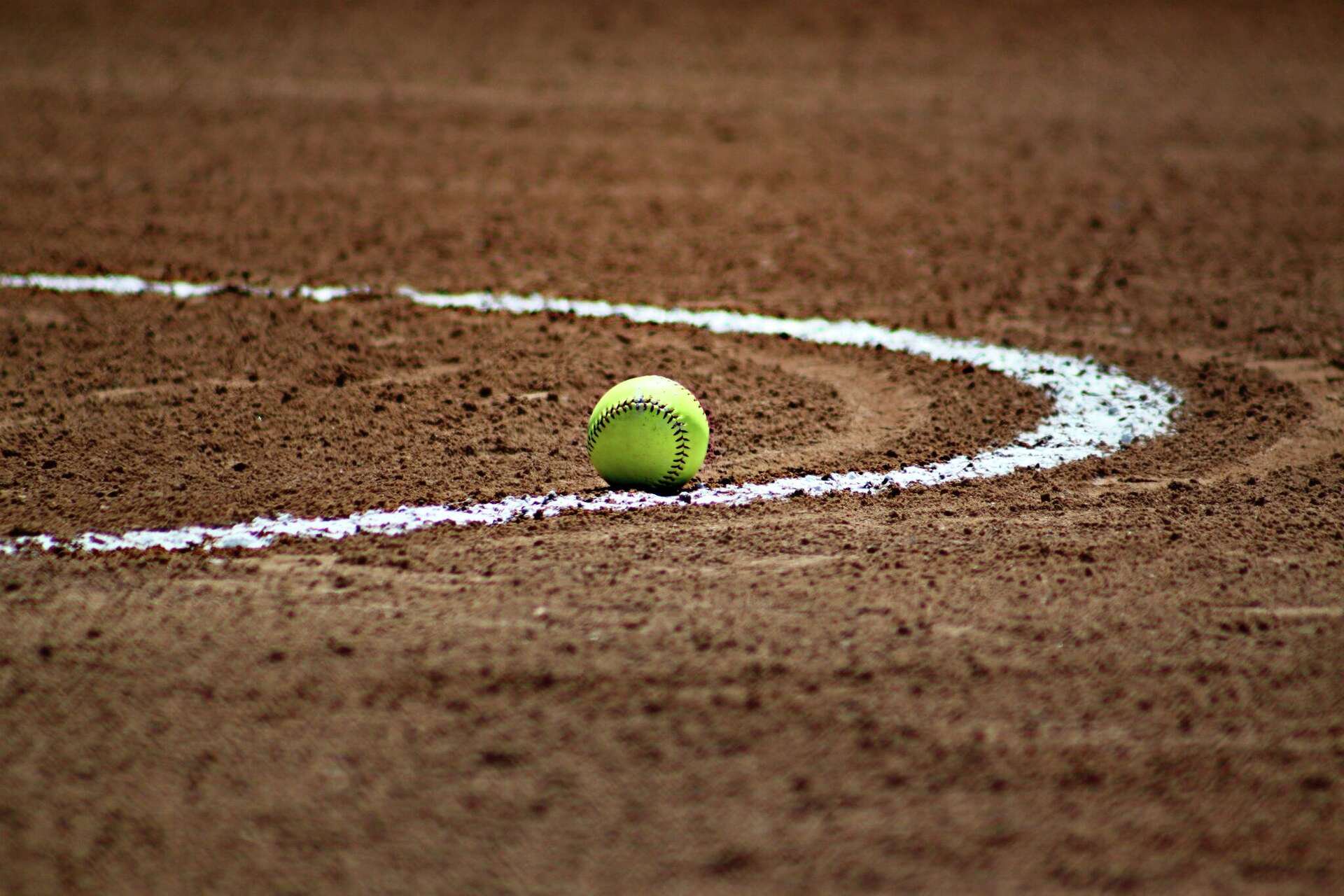 Several Texas youth softball teams are leaving a nationally ranked academy after a former coach accused the organization of mishandling her sexual harassment complaint against another coach.