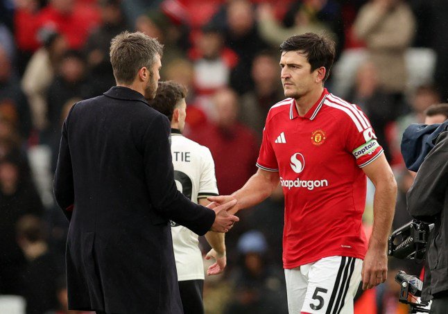 Soccer Football - Premier League - Manchester United v AFC Bournemouth - Old Trafford, Manchester, Britain - October 25, 2026 Manchester United manager Michael Carrick with Harry Maguire after the match REUTERS/Chris Radburn EDITORIAL USE ONLY. NO USE WITH UNAUTHORIZED AUDIO, VIDEO, DATA, FIXTURE LISTS, CLUB/LEAGUE LOGOS OR 'LIVE' SERVICES. ONLINE IN-MATCH USE LIMITED TO 120 IMAGES, NO VIDEO EMULATION. NO USE IN BETTING, GAMES OR SINGLE CLUB/LEAGUE/PLAYER PUBLICATIONS. PLEASE CONTACT YOUR ACCOUNT REPRESENTATIVE FOR FURTHER DETAILS..