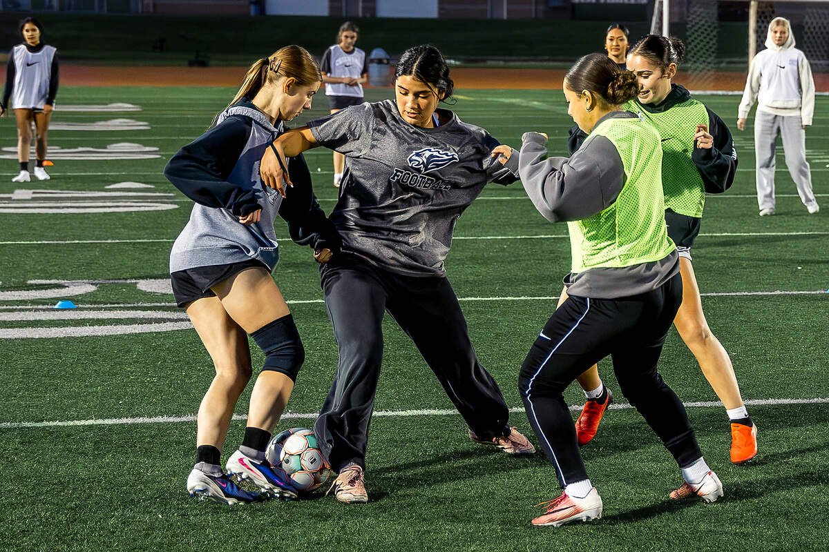 Chiawana High School girls soccer players battle for possession of the ball during a practice drill Monday, Oct. 26, 2026, at Chiawana High School in Pasco, Wash. The Riverhawks open the District 6 Class 4A girls soccer playoffs Tuesday at 6 p.m. against Ferris at Chiawana High School.
