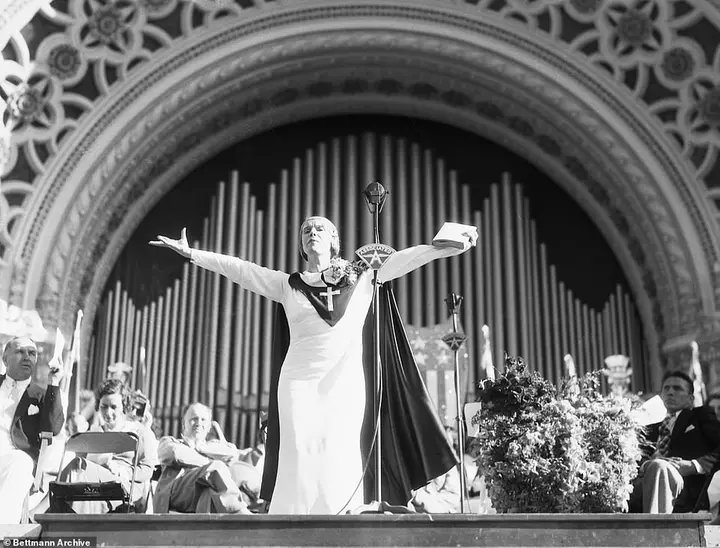Sister Aimee Semple McPherson travelling tabernacle eclipsed every theatrical and political touring event in American history between 1919- 1922. Above, she addressees a crowd of 30,000 followers in San Diego in 1921. The Marines were called-in to control the frenzied audience who flocked to see her preach and conduct faith healing performances. She shouted in her frayed, contralto voice to bring forward, 'the worst sinner in San Diego!'
