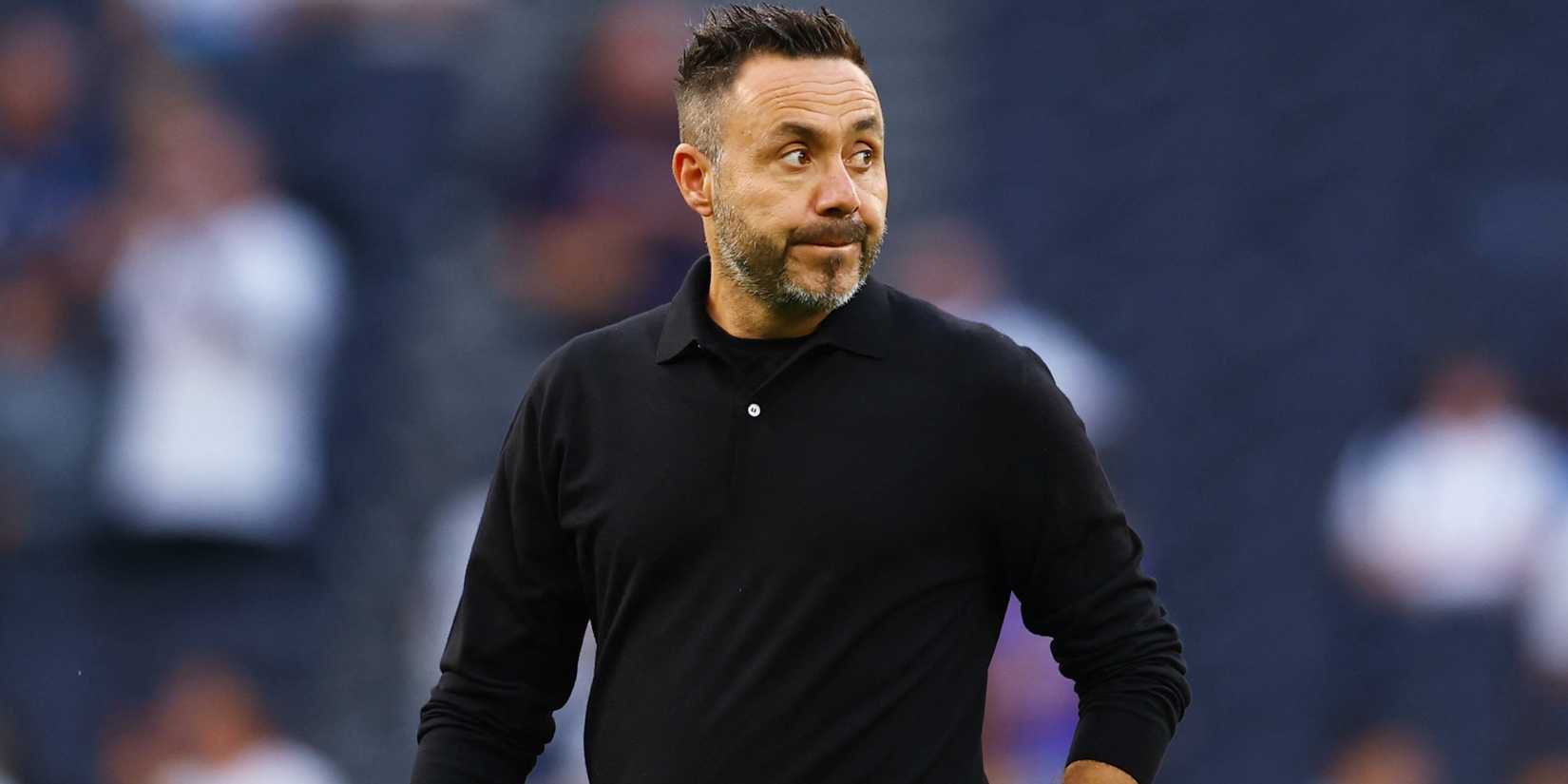 Tottenham manager Roberto De Zerbi walks across the pitch