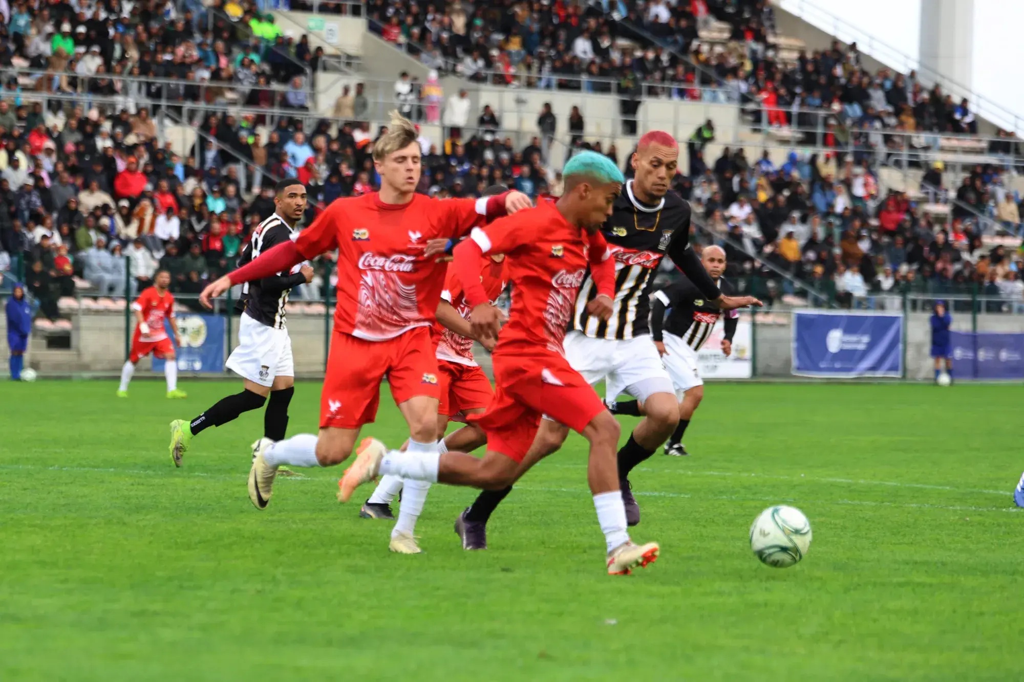 Hanover Park live wire Imtiyaaz Ruiters goes on the attack during Saturday’s Coke Cup final at Athlone Stadium.