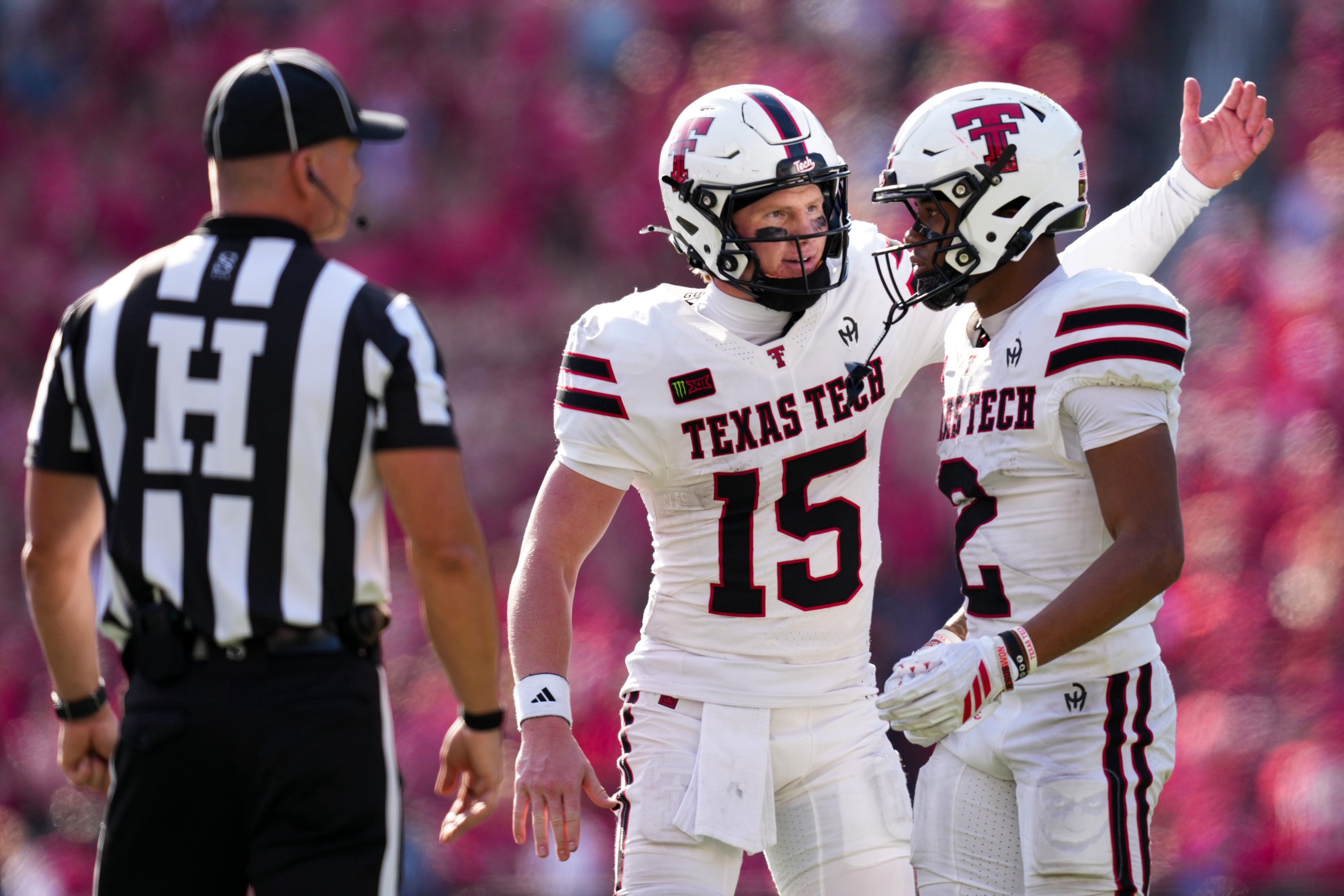 Oct 24, 2026; Cincinnati, Ohio, USA;  Texas Tech Red Raiders quarterback Will Hammond (15) greets wide receiver Kenny Johnson (2) on the sideline during the game against the Cincinnati Bearcats in the second half at Nippert Stadium. Mandatory Credit: Aaron Doster-Imagn Images