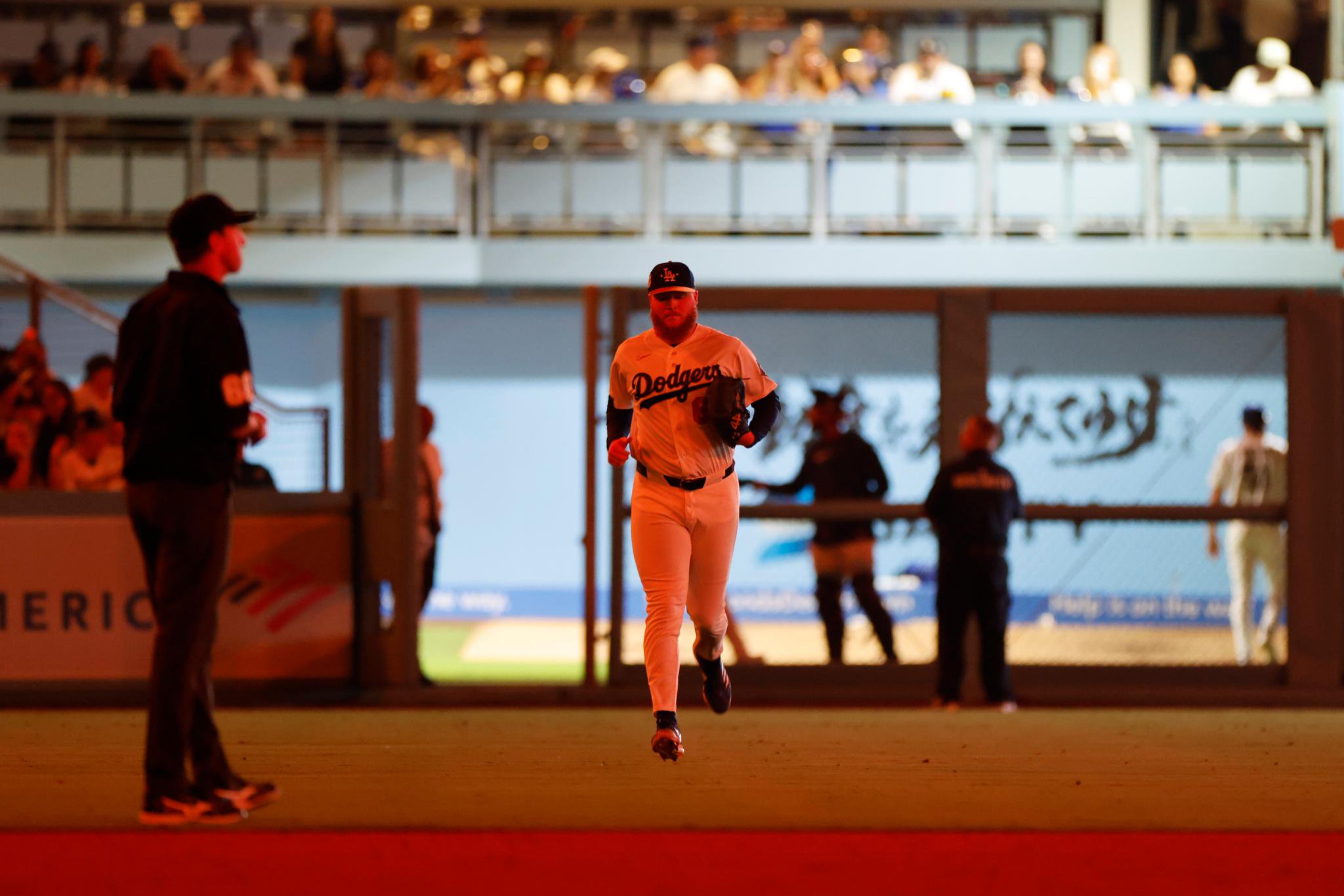 Los Angeles Dodgers pitcher Will Klein jogs onto the field at Dodger Stadium.
