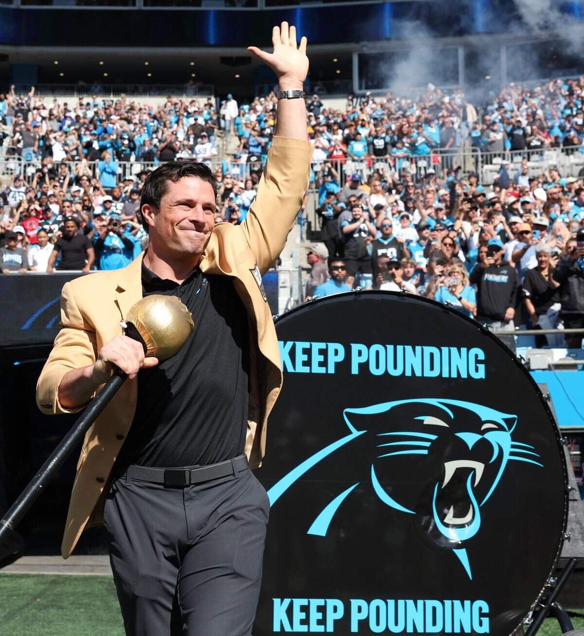 Former Carolina Panthers linebacker Luke Kuechly acknowledges the cheers of the fans after hitting the Keep Pounding drum prior to the team’s game against the Tampa Bay Buccaneers at Bank of America Stadium in Charlotte, NC on Sunday, October 25, 2026.