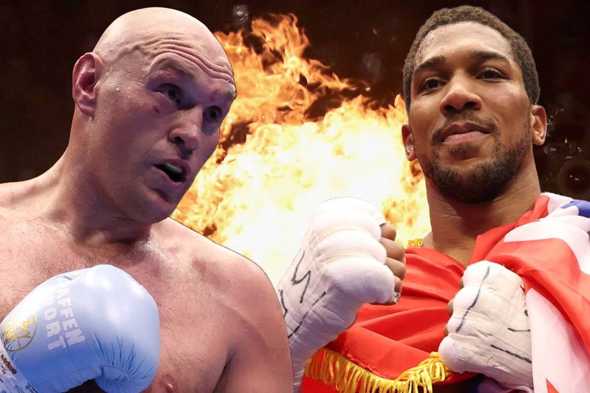 Two male boxers are facing each other in front of a fiery background, each wearing boxing gloves and looking focused.