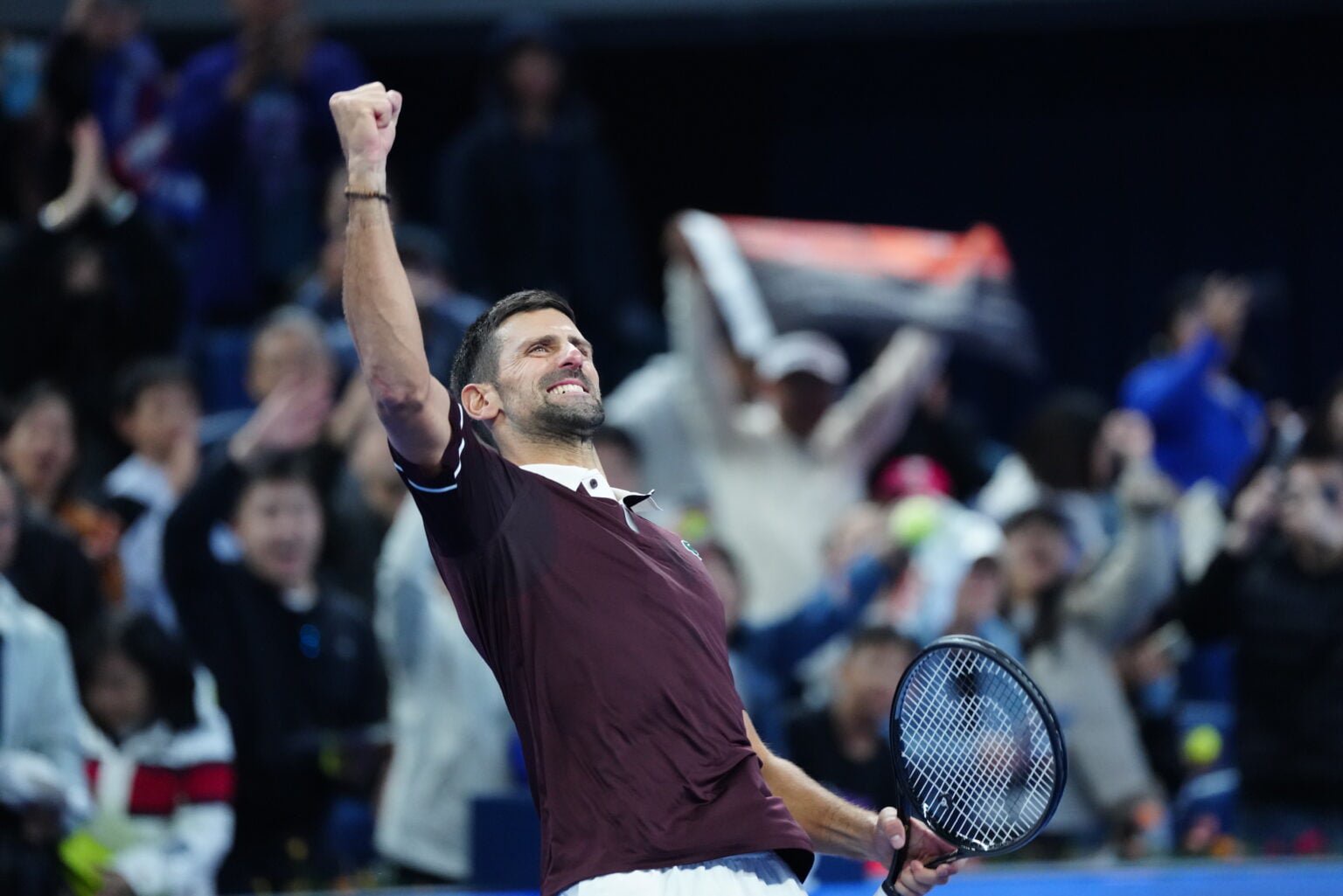 Novak Djokovic celebrates at the China Open.