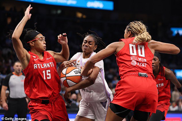 Tiffany Hayes #15 of the Golden State Valkyries drives to the basket between Allisha Gray #15 and Naz Hillmon #00 of the Atlanta Dream during the third quarter of Game 6