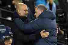 Manchester City's Spanish manager Pep Guardiola (L) greets Tottenham Hotspur's Greek-Australian Head Coach Ange Postecoglou (R) ahead of kick-off i...