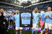 Fernandinho of Manchester City presents Sergio Aguero of Manchester City with a commemorative Manchester City shirt following his last game for Manchester City following the Premier League match between Manchester City and Everton at Etihad Stadium on May 23, 2021 in Manchester, England. A limited number of fans will be allowed into Premier League stadiums as Coronavirus restrictions begin to ease in the UK. 