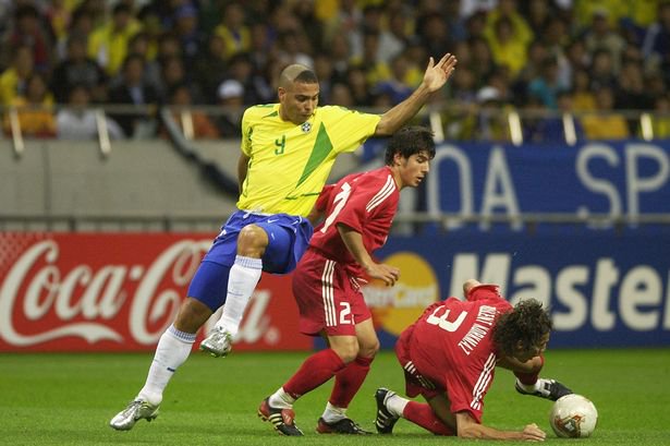 SAITAMA - JUNE 26: Ronaldo of Brazil is denied by Emre Belozoglu and Bulent Korkmaz of Turkey during the Brazil v Turkey, World Cup Semifinal Stage match played at the Saitama Stadium, Saitama in Japan on June 26, 2002. Brazil won 1-0. (Photo by Stu Forster/Getty Images)
