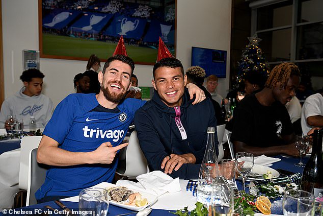 Midfielder Jorginho embraces his team-mate Thiago Silva as player enjoy the festivities