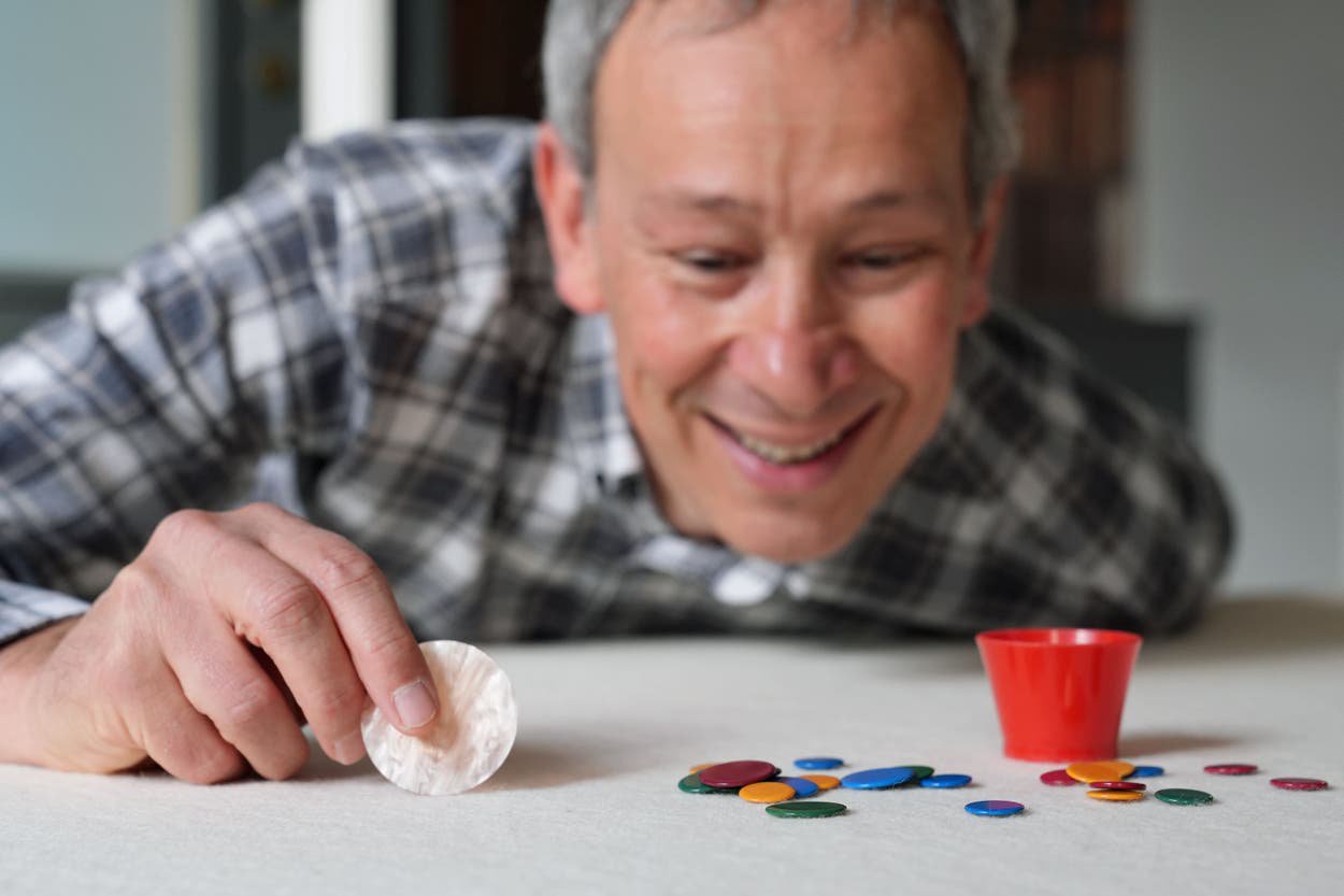 Reigning champion Patrick Barrie from Cambridge, who won the 2026 World Singles Tiddlywinks Championship, at the Castle Inn pub in Cambridge (Joe Giddens/ PA)