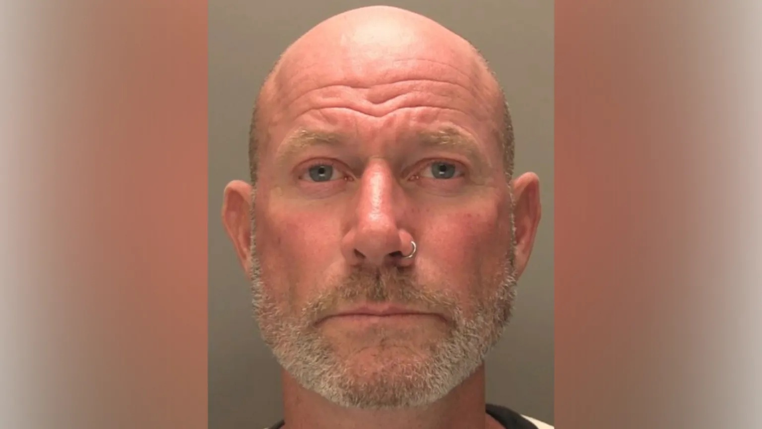 Lincolnshire Police A police custody shot of Allan Barrass. He has a bald head and short grey stubble. He has a small silver nose ring in his left nostril.