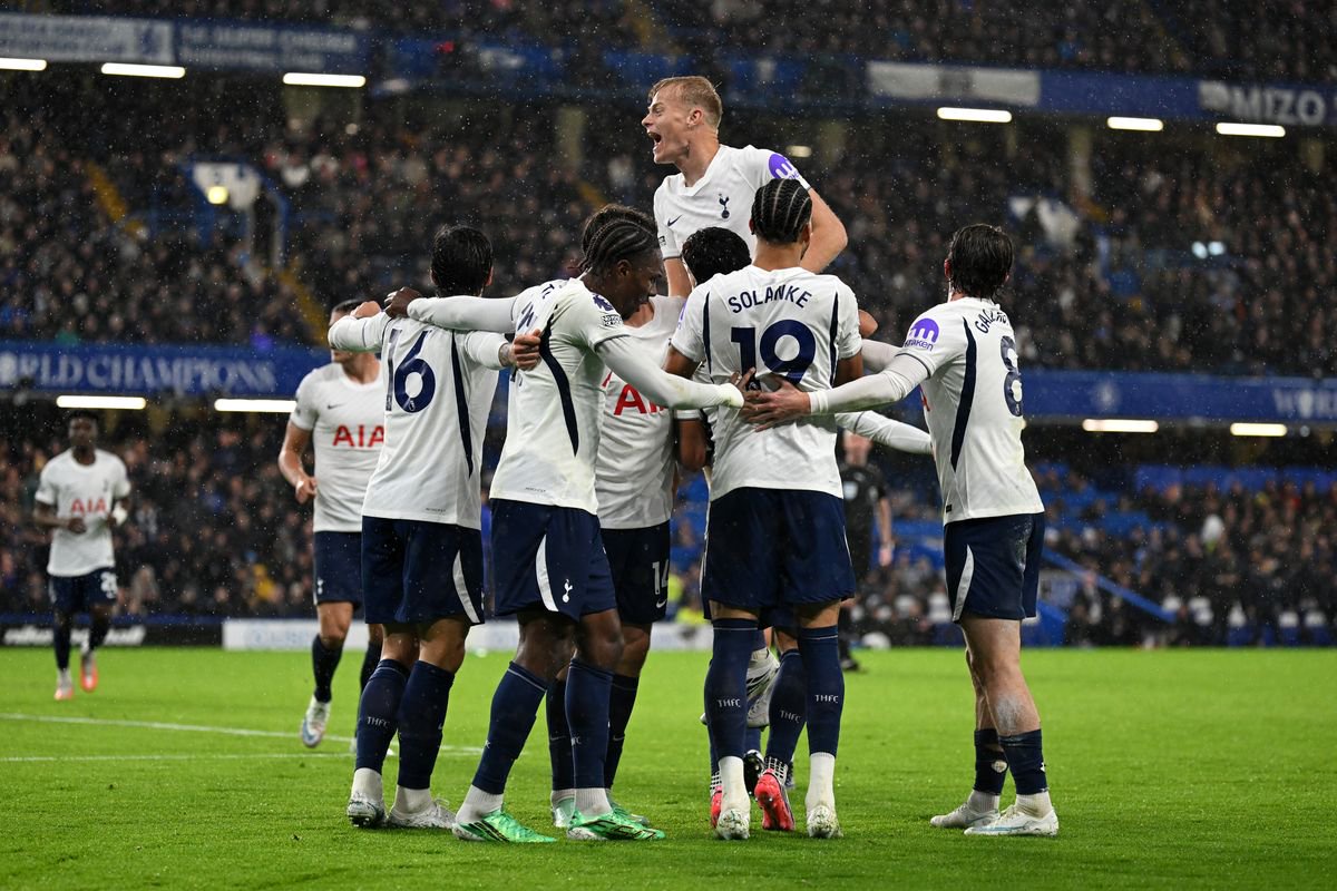 Tottenham Hotspur players celebrate after Mike Penders' own goal