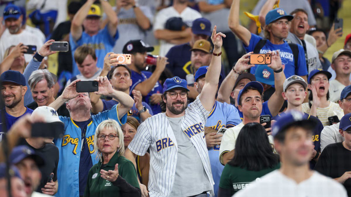 Milwaukee Brewers fans celebrate in the stands at Dodger Stadium.