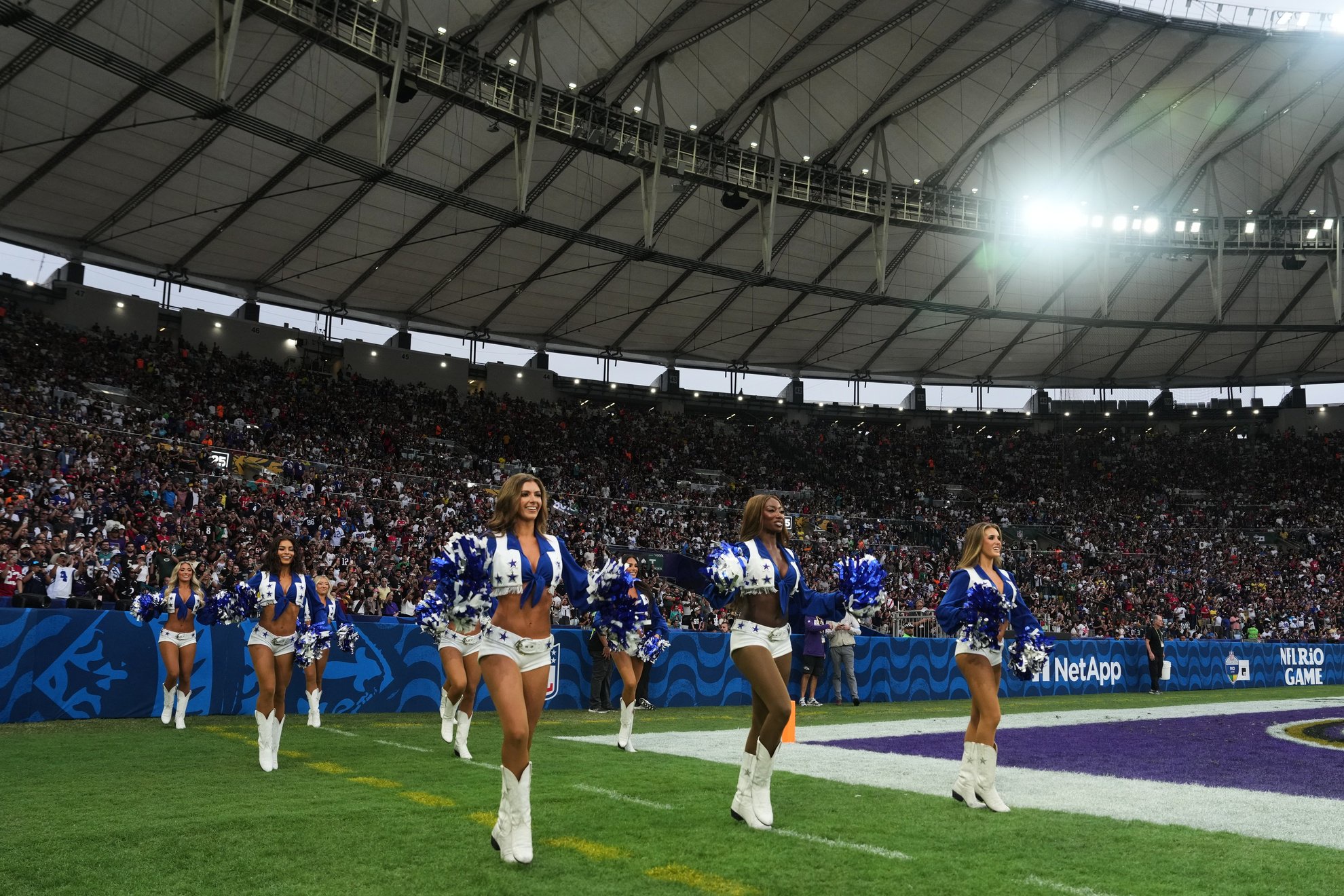 The Dallas Cowboys cheerleaders enter the field