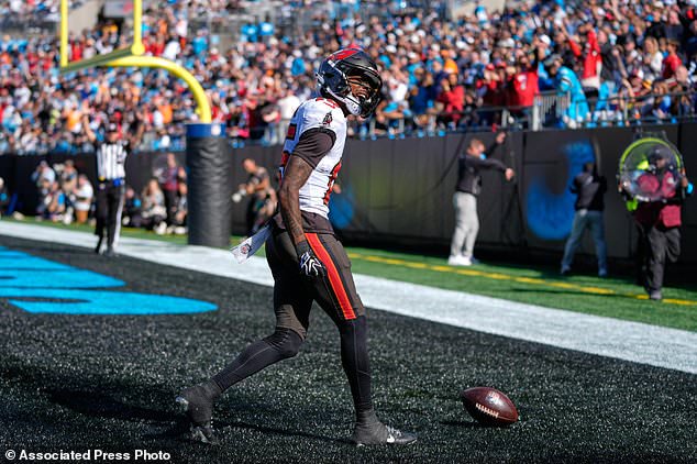 Tampa Bay Buccaneers wide receiver Tez Johnson (15) celebrates his touchdown catch during the first half of an NFL football game against the Tampa Bay Buccaneers in Charlotte, N.C., Sunday, Oct. 25, 2026. (AP Photo/Erik Verduzco)