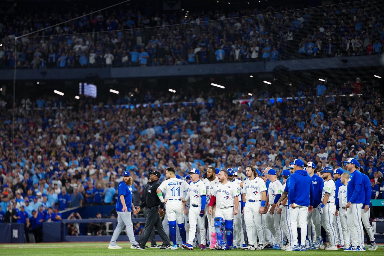 TORONTO, ON - NOVEMBER 01:   Members of the Toronto Blue Jays stand on the field after Andrés Giménez #0 of the Toronto Blue Jays was hit by a pitch from Justin Wrobleski #70 of the Los Angeles Dodgers in the fourth inning during Game Seven of the 2025 World Series presented by Capital One between the Los Angeles Dodgers and the Toronto Blue Jays at Rogers Centre on Saturday, November 1, 2025 in Toronto, Ontario, Canada. (Photo by Daniel Shirey/MLB Photos via Getty Images)