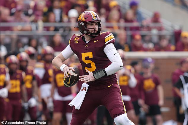 Minnesota quarterback Drake Lindsey (5) throws a pass during the first half of an NCAA college football game against Iowa, Saturday, Oct. 24, 2026, in Minneapolis. (AP Photo/Bailey Hillesheim)