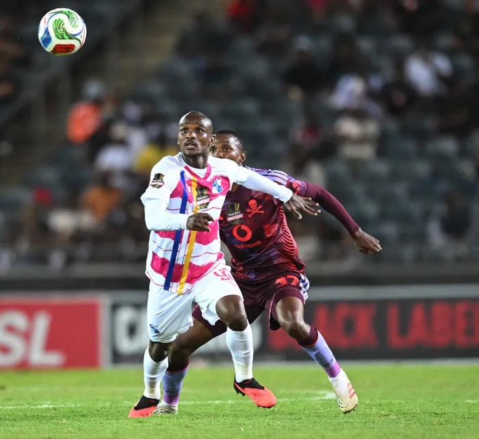 Sbangani Zulu of Orlando Pirates challenges Scelo Masilela of Milford FC during the Carling Knockout Cup Last 16 match. The picture paints one of the duels that left Pirates coach Abdeslam Ouaddou fuming and blaming his players for coming out second best most of the time. 