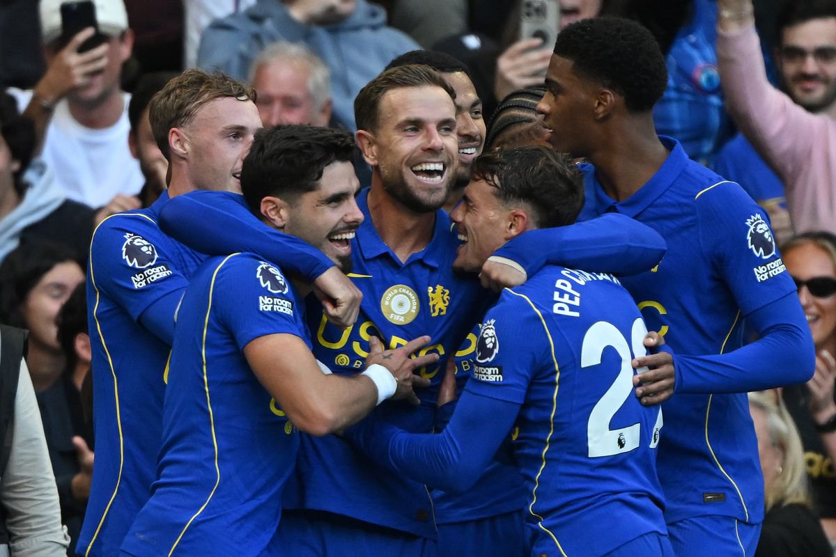 Jordan Henderson of Chelsea celebrates with team mates after scoring his second goal and the team's fifth during the Premier League match against Bournemouth
