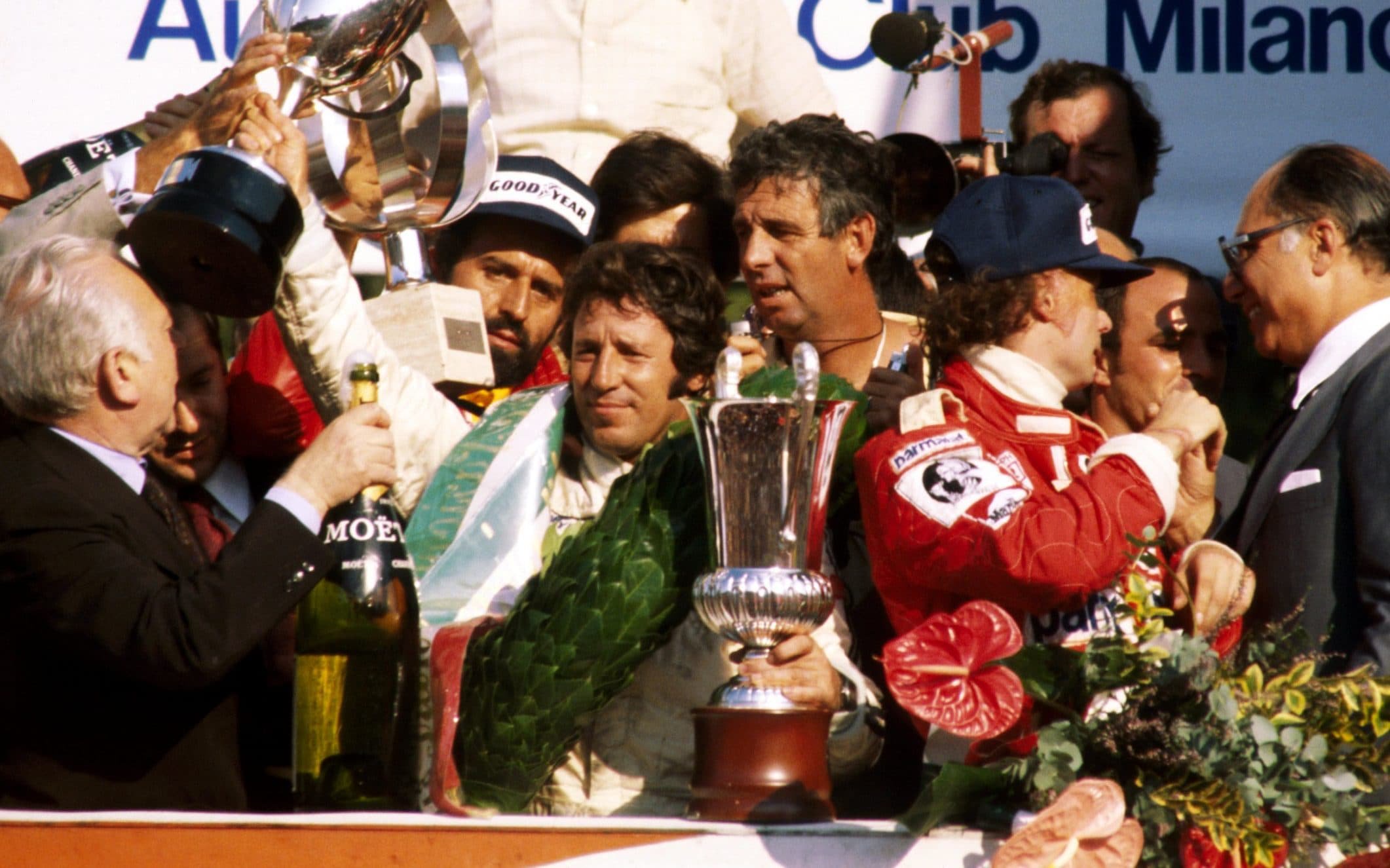 The packed podium (L to R): Mario Andretti (USA) Lotus winner; Niki Lauda (AUT) Ferrari, second; Alan Jones (AUS)