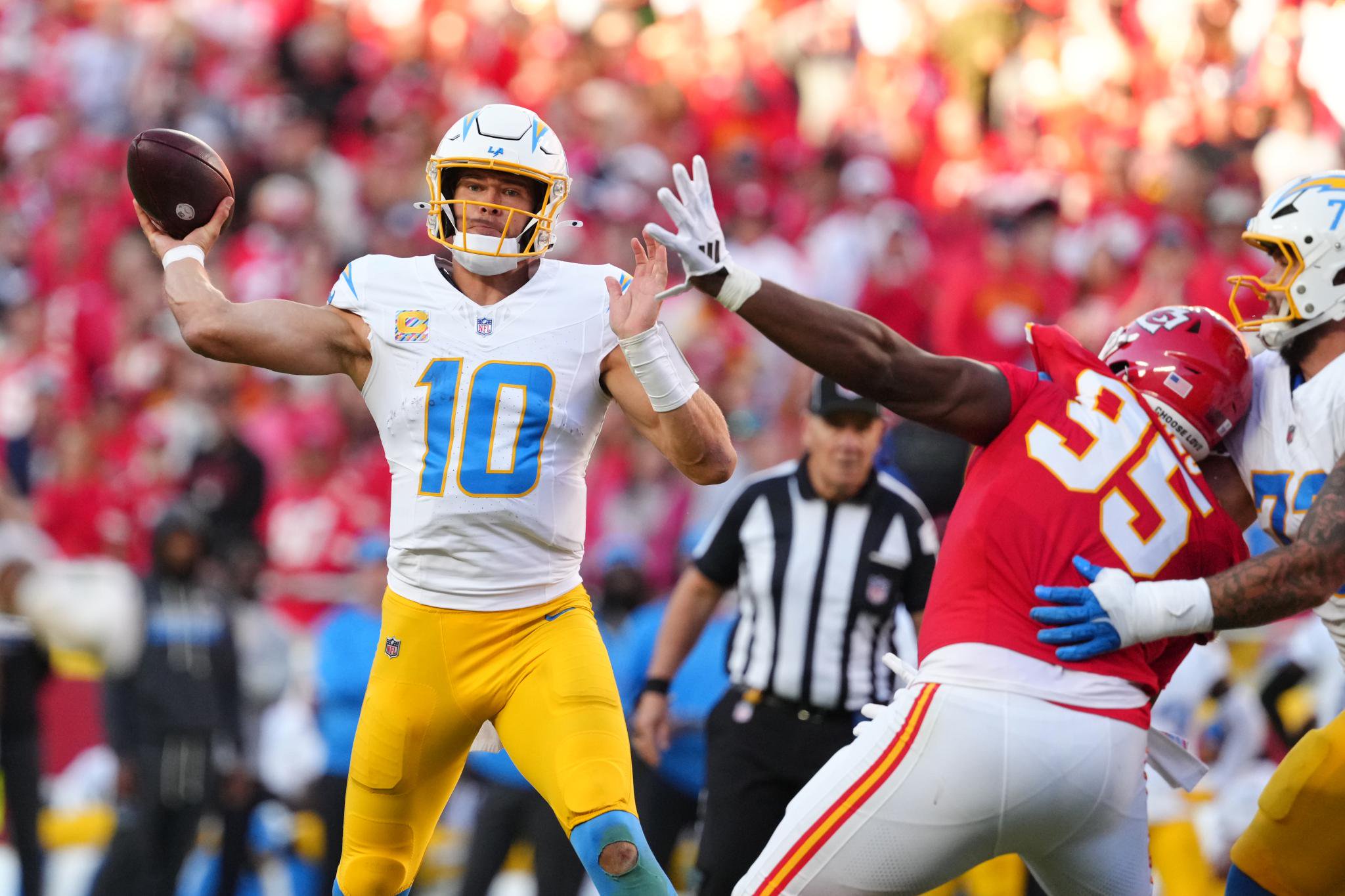 Los Angeles Chargers quarterback Justin Herbert throws a pass under pressure from Kansas City Chiefs defensive tackle Chris Jones.