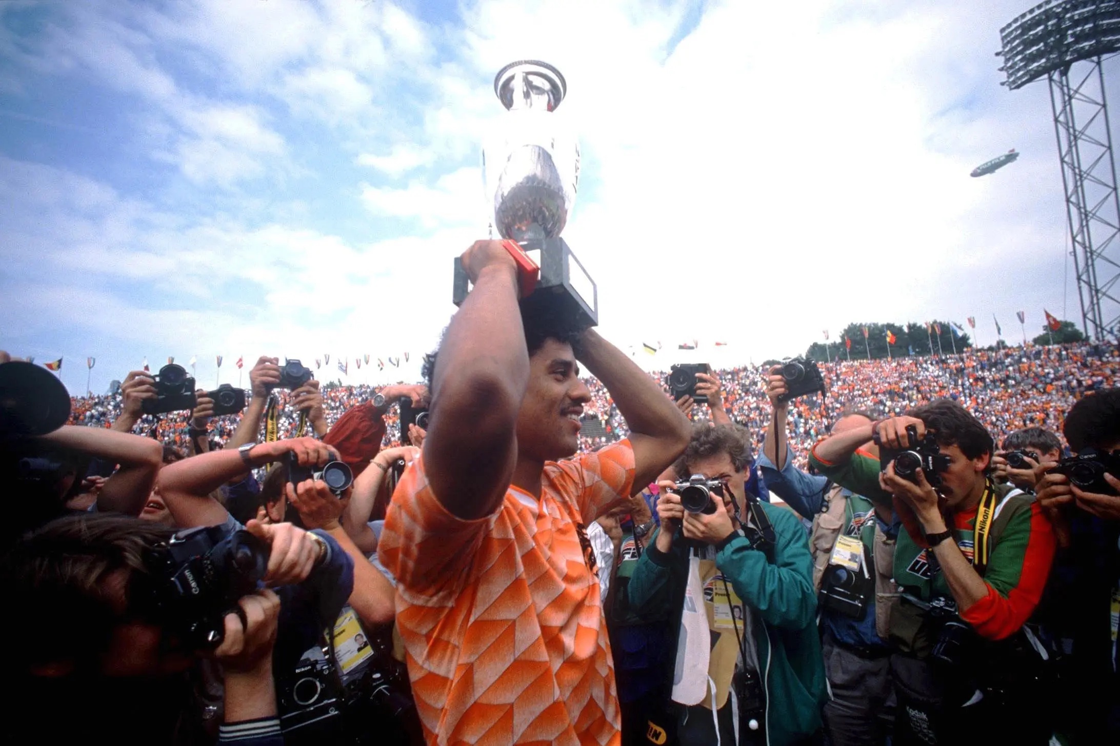 Frank Rijkaard hoisting aloft the European Championship trophy.