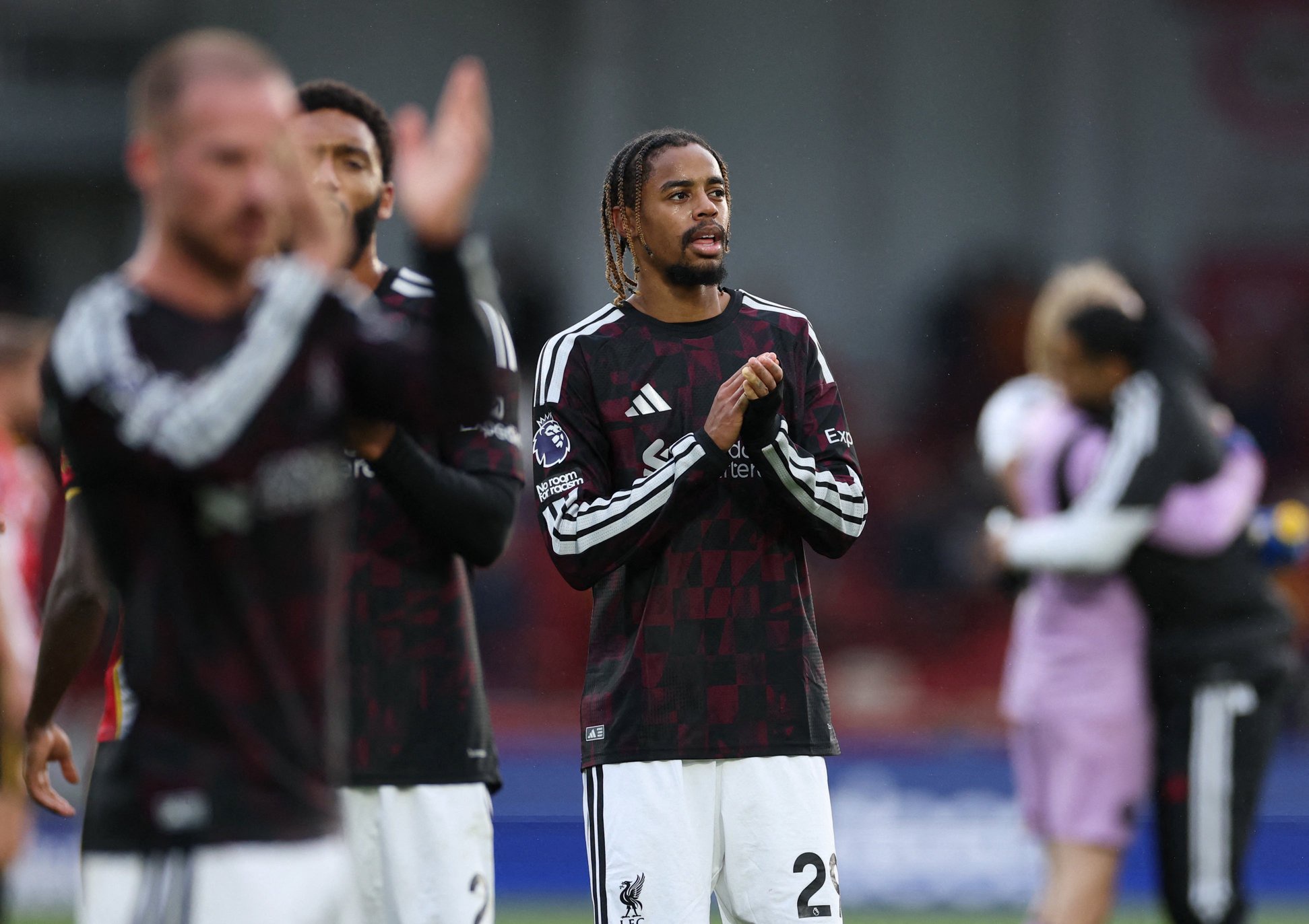 Liverpool's Bradley Barcola applauds fans after the match against Brentford