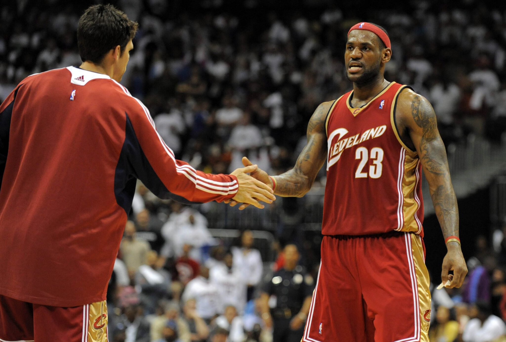 May 9, 2009; Atlanta, GA, USA; Cleveland Cavaliers forward LeBron James (23) shakes hands with guard Wally Szczerbiak (10) after making the last shot of the game against the Atlanta Hawks in the fourth quarter of game four of the eastern conference semifinals at Philips Arena. The Cavaliers defeated the Hawks 84-74 and will advance to the eastern conference finals. Mandatory Credit: Dale Zanine for the Akron Beacon Journal via USA TODAY Sports
