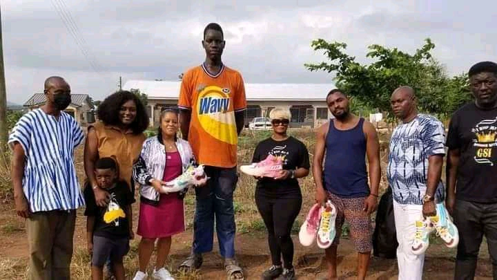Tallest Guy in Ghana finally gets his requested shoe size from kind Donors (photos)