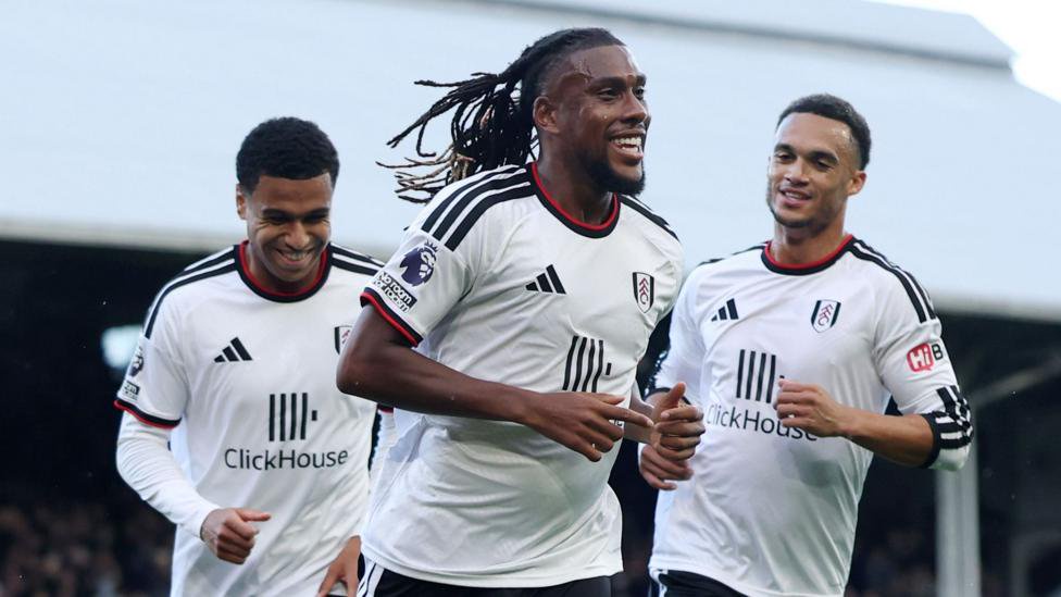 Fulham's Alex Iowbi jogs towards the stands as he celebrates scoring with his team-mates