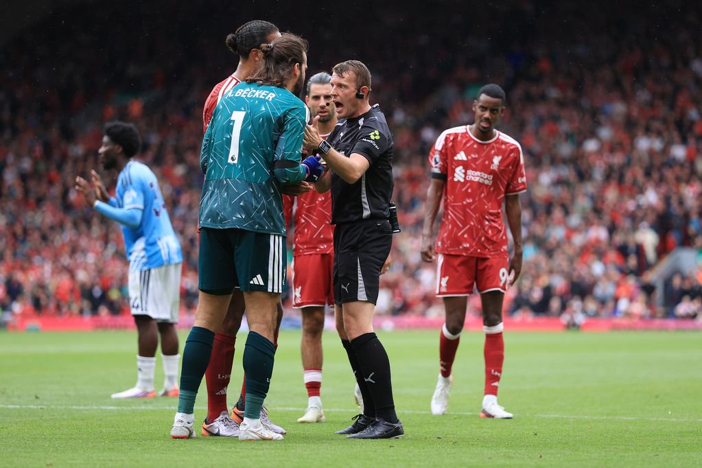 Referee Sam Barrott waves away protests from Liverpool goalkeeper Alisson Becker during the Premier League 2026/27 match between Liverpool FC and Nottingham Forest FC