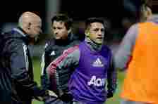 Alexis Sanchez wears a purple bib in a Manchester United warm-up session.
