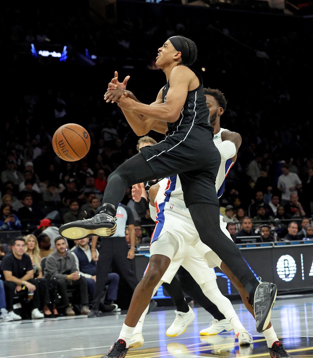 Brooklyn Nets guard Mikel Brown Jr. (0) loses the ball as he is fouled during a game against the Detroit Pistons at Barclays Center.