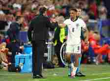 Gareth Southgate, Head Coach of England, shakes hands with Trent Alexander-Arnold