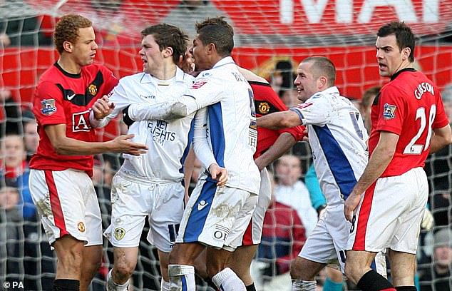 ... and the confrontations have continued down the decades - with Jermaine Beckford and Wes Brown squaring up during Leeds' win in the FA Cup at Old Trafford in 2010