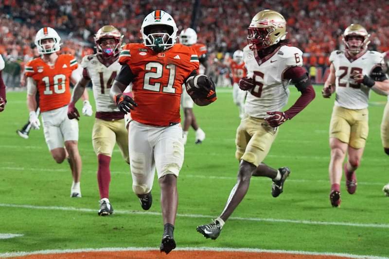 Miami running back Javian Mallory scores a touchdown during the first overtime.