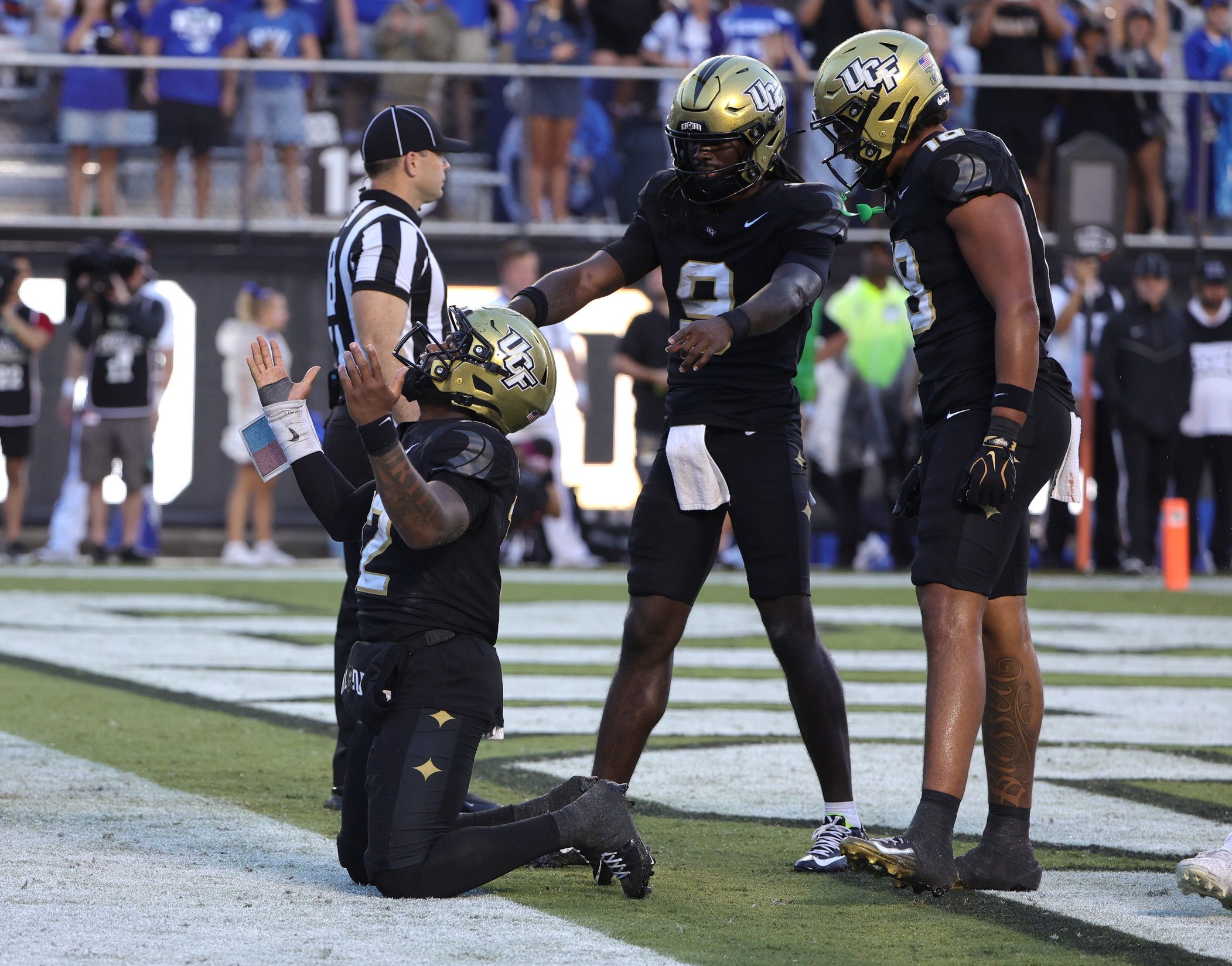 Oct 24, 2026; Orlando, Florida, USA;  Central Florida Knights quarterback Keyone Jenkins (12) celebrates a touchdown run during the third quarter against the Brigham Young Cougars at Acrisure Bounce House.  Mandatory Credit: Mike Watters-Imagn Images
