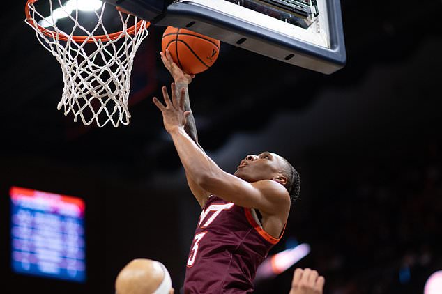 FILE - Virginia Tech guard Ben Hammond (3) gets to the rim against Virginia during the first half of an NCAA college basketball game, Saturday, March 7, 2026, in Charlottesville, Va. (AP Photo/Robert Simmons,File)