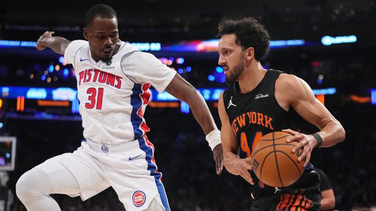 Detroit Pistons' Javonte Green defends New York Knicks' Landry Shamet. (AP Photo/Frank Franklin II)