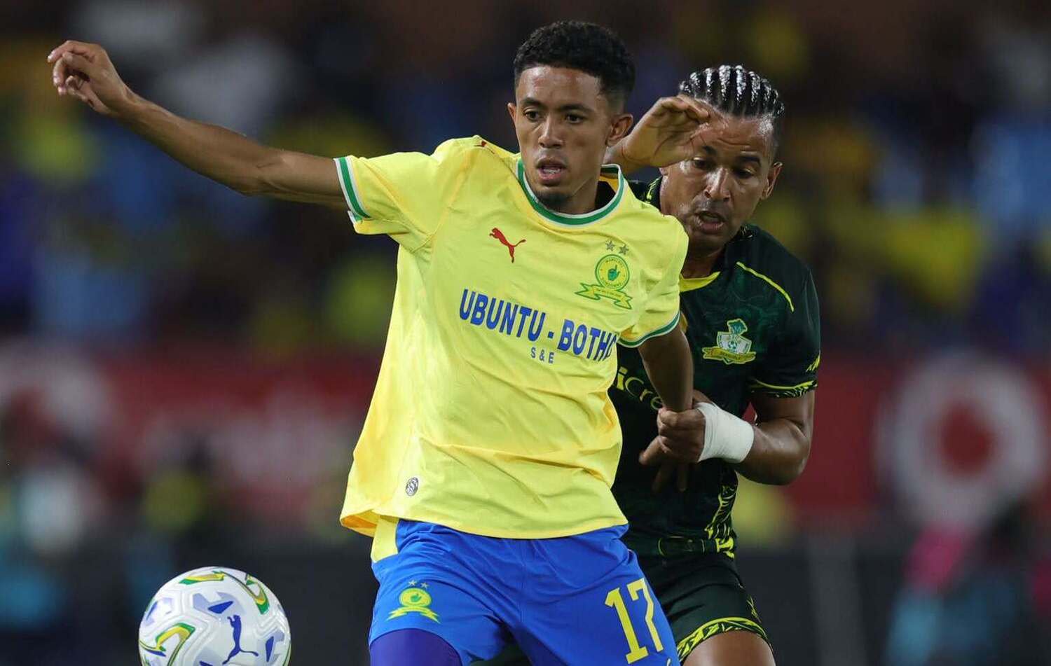 Mamelodi Sundowns winger Tashreeq Matthews being challenged by a Wiliete SC player