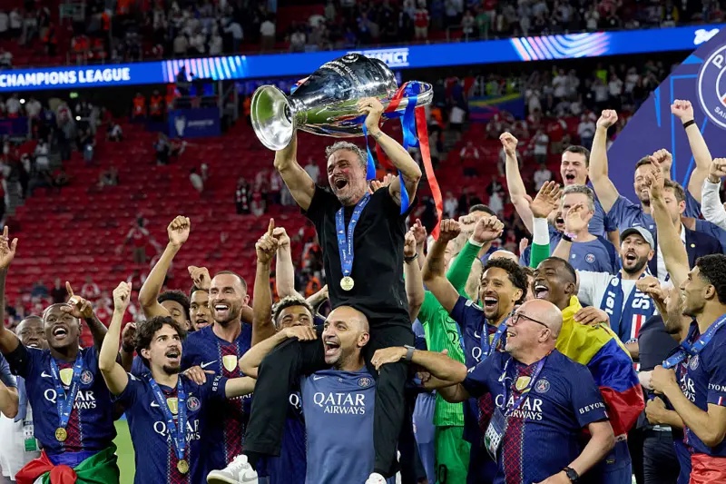 Luis Enrique holding the Champions League trophy