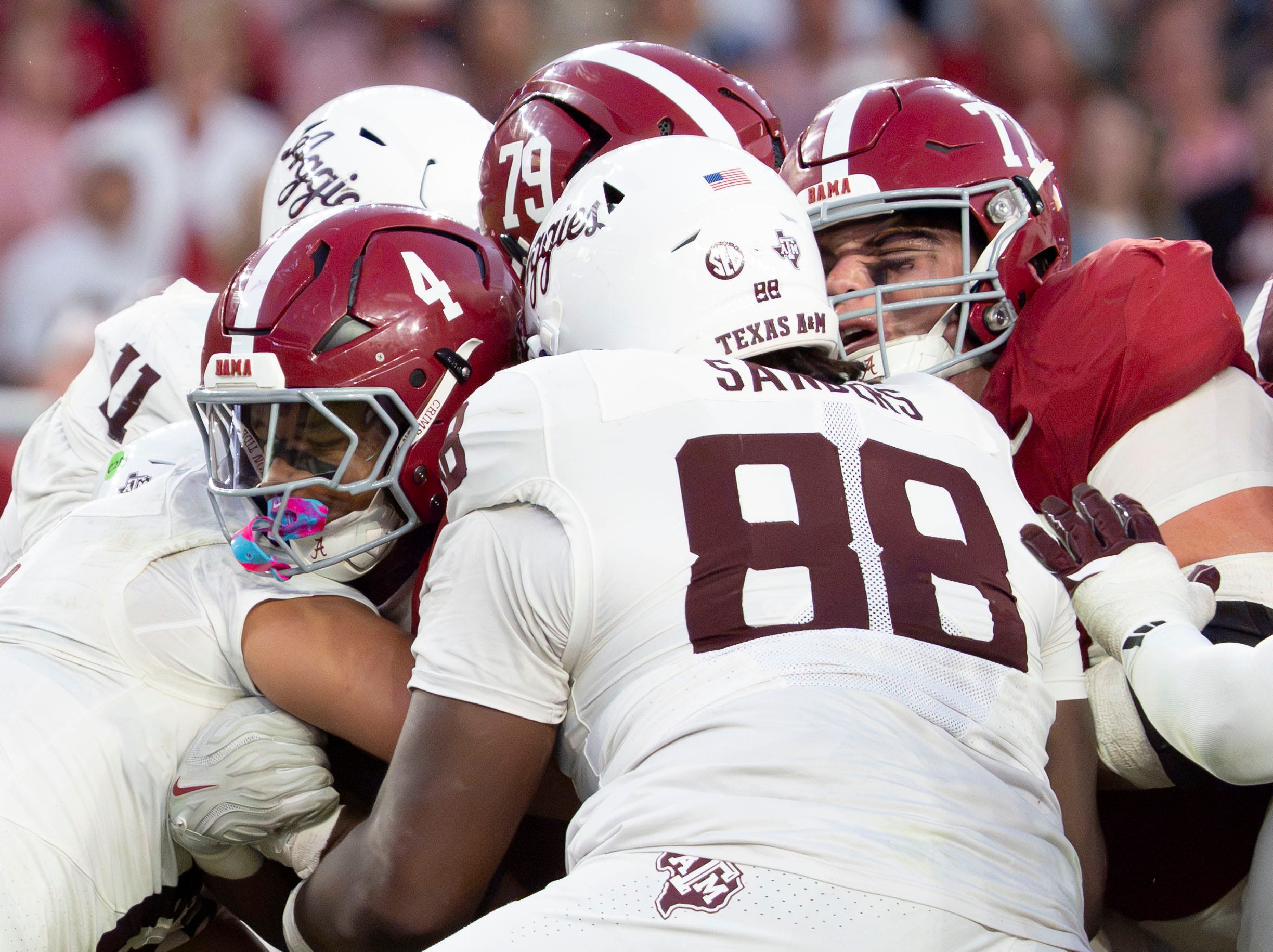 Oct 24, 2026; Tuscaloosa, AL, USA; Alabama running back Daniel Hill (4) pushes through the pile for a first down with help from Alabama offensive lineman Kaden Strayhorn (79) and Alabama offensive lineman Jackson Lloyd (77) at Saban Field at Bryant Denny Stadium. 