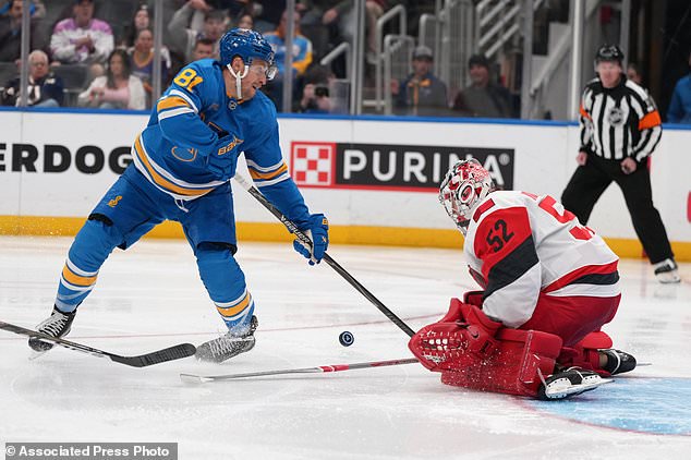 St. Louis Blues' Dylan Holloway (81) is unable to score past Carolina Hurricanes goaltender Pyotr Kochetkov (52) during the second period of an NHL hockey game Saturday, Oct. 24, 2026, in St. Louis. (AP Photo/Jeff Roberson)