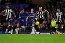 Chelsea's Argentinian midfielder #08 Enzo Fernandez (L) fights for the ball with Newcastle United's Brazilian midfielder #39 Bruno Guimaraes during...